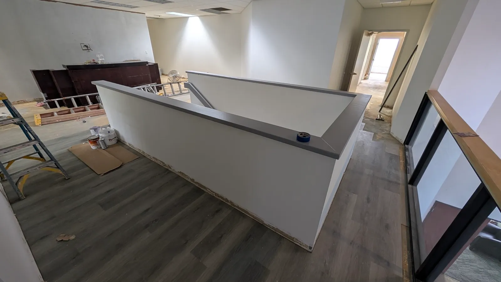 The finished reception desk and corridor of the completed commercial fit-out